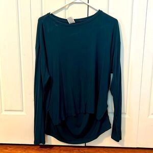 All in motion teal long sleeve work out top.